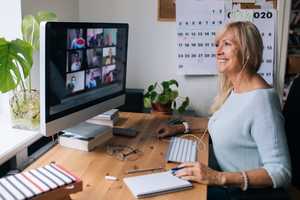 Business woman on a video conference in home office