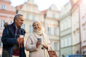 Older couple walking in the city in winter
