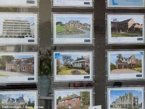 Homes for sale in an estate agent's window