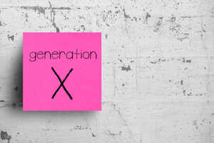 Generation X written on a pink post-it note, stuck on a concrete wall