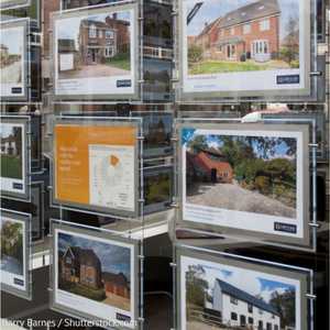 Properties for sale in an estate agents' window