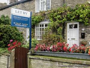 Stone country cottage with let-by estate agent board