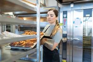 Young female worker in a bakery